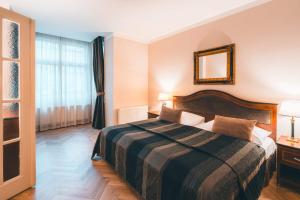 Posteľ alebo postele v izbe v ubytovaní Elysee Hotel
