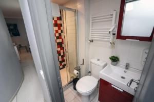 a small bathroom with a toilet and a sink at Arkem Hotel 3 in Istanbul