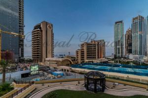 a view of a city with tall buildings at Royal Beach Residence in Dubai