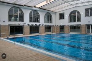 a large swimming pool in a building at Napuletanata in Naples