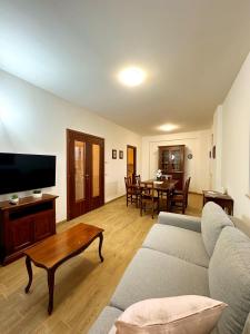 a living room with a couch and a table at La Casa di Garibaldi - Vista per le Montagne in San Demetrio neʼ Vestini +35 photos