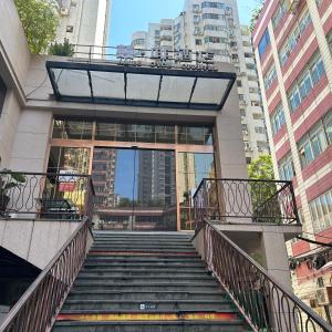 a staircase leading up to a building in a city at 啡酒店（天河北店） in Guangzhou