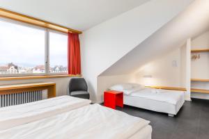Letto o letti in una camera di Hotel Marta