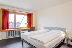 Letto o letti in una camera di Hotel Marta