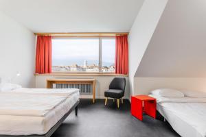 Letto o letti in una camera di Hotel Marta