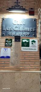 a display of signs on a wall in a store at Casa Rural Los Galanes in Villanueva de los Infantes