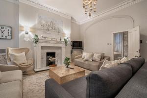 a living room with a couch and a fireplace at Stay Trafalgar Square in London