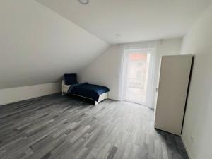 Postel nebo postele na pokoji v ubytování Apartment Weikersheim II
