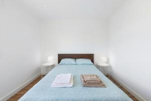 Postel nebo postele na pokoji v ubytování Agualva Happy Apartment