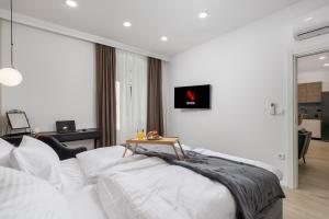 מיטה או מיטות בחדר ב-Area Luxury Spa Apartment