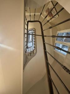 a spiral staircase with a mirror in a room at Résidence Gambetta in Cannes