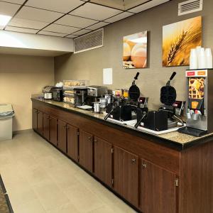 a kitchen with a counter with coffee machines on it at Comfort Inn Falls Church - Tysons Corner in Falls Church