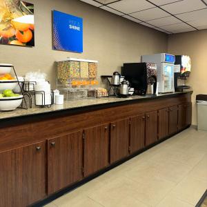 a cashier counter in a hotel room with at Comfort Inn Falls Church - Tysons Corner in Falls Church
