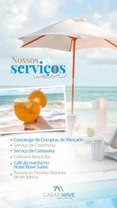 un ombrellone e una sedia in spiaggia di Casa Sol Ipioca a Maceió