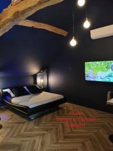 Postel nebo postele na pokoji v ubytování Calme et Volupté