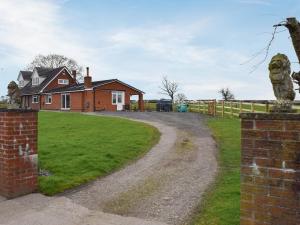 a dirt road in front of a house at The Crofts in Winsford