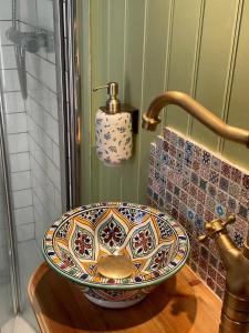 a sink in a bathroom with a faucet at The Skewbald in Letterbreen +29 photos