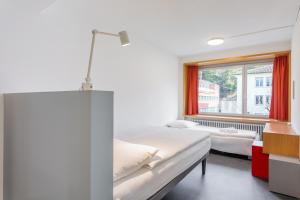 Letto o letti in una camera di Hotel Marta