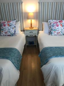 Ένα ή περισσότερα κρεβάτια σε δωμάτιο στο Cherry Berry Lodge