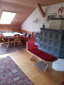 a living room with a blue cabinet and a table at Bauernhaus Durrahof in Steinberg am Rofan