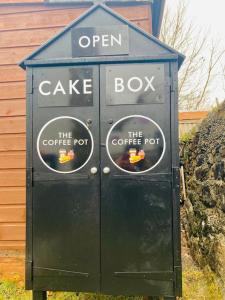an open cake box with two stickers on it at Argyll House Burnside in Salen