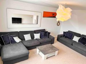 a living room with a couch and a table at Wonderful Beach House Just 250m From The Sea in Newquay