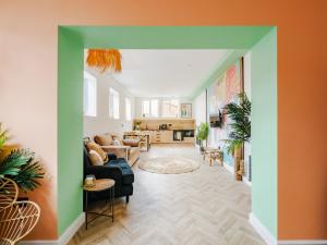 a living room with a couch and a table at Rise Duplex Apartments - Market Harborough in Market Harborough