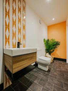a bathroom with a sink and a toilet at Rise Duplex Apartments - Market Harborough in Market Harborough