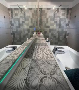 a bathroom with two sinks and a bath tub at Paz Ocean View, 2 Air Conditioners, Wifi, Heated pool in San Miguel de Abona
