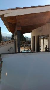 a view of a house from a balcony at Casa preciosa con vistas in Granada