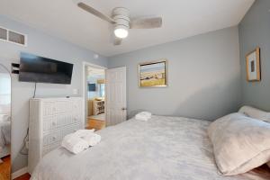 a bedroom with a bed and a ceiling fan at Town of Rehoboth Beach - 50A Olive Ave in Rehoboth Beach
