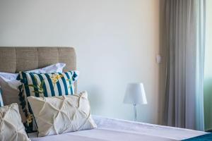 Un pat sau paturi într-o cameră la Apartamento Monumental - By WeHost Madeira