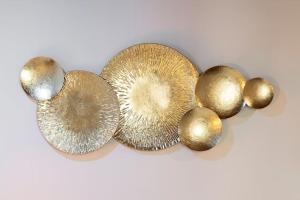 a group of gold and silver spheres on a white background at Keys of Italy - Erta Canina 36 - Studio in S-Niccolò for 1 or 2 guests in Florence
