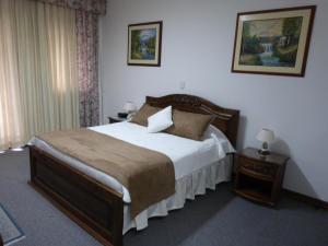 Ένα ή περισσότερα κρεβάτια σε δωμάτιο στο El Gran Hotel de Pereira