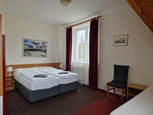 Katil atau katil-katil dalam bilik di Hotel Harrachov Inn