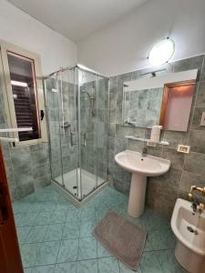 a bathroom with a shower and a sink at Da Bosio in Genga