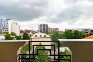 a balcony with a view of a city at Hotel City Star in Pristina
