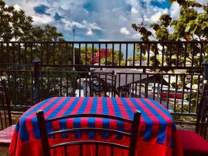 a table with a colorful blanket on top of a fence at R & D Resort in Polonnaruwa