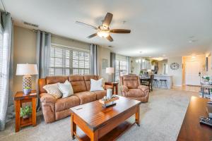 a living room with a couch and a table at Branson Condo with Pool about 3 Mi to Silver Dollar City in Branson West