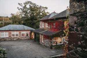 an aerial view of a house with ivy on it at Wooladon House in Lifton