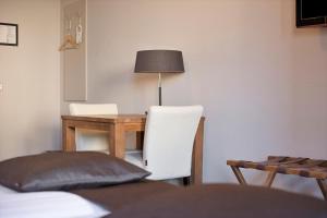 TV a/nebo společenská místnost v ubytování Hunzego Hotel