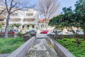 a city street with parked cars and buildings at Bells & Whistles, Comfortable Condo in Split