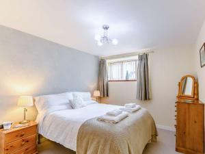 a bedroom with a bed with towels on it at 2 Bed in Keswick 28383 in Braithwaite