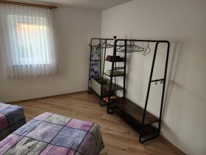 a room with a shelf in the corner of a room at Ferienwohnung Julija Riedheim in Hilzingen