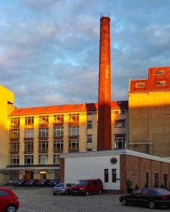 a brick building with a tower on top of it at Einzigartiges 140qm LOFT – Party ist erlaubt! in Berlin