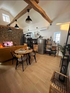 a living room with a table and a couch at Holiday Home Forest INN in Sveti Martin na Muri
