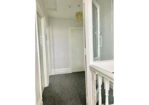 a hallway with a door leading to a room at Pleasant 1 Bed Budget Apartment Near Blackpool City Centre 4 in Blackpool