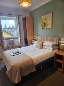 Postel nebo postele na pokoji v ubytování Park Lodge Hotel