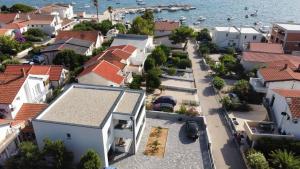 an aerial view of a town with houses and the water at Apartment ValMar in Vir