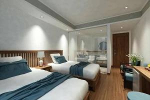 A bed or beds in a room at Tam Coc Condelux Boutique Hotel & Travel